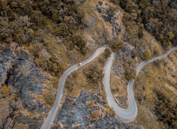 Car on hilly, twisty road