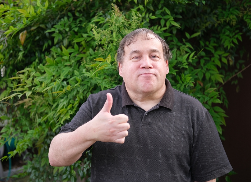 Man with autism giving thumbs up 