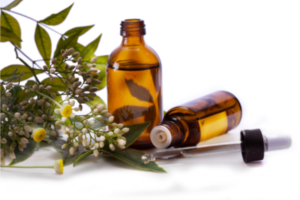 Brown bottles with eyedropper and flowers